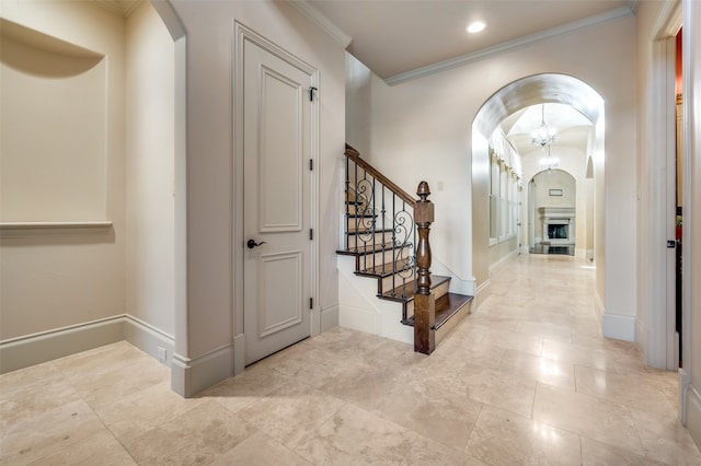 hallway featuring ornamental molding