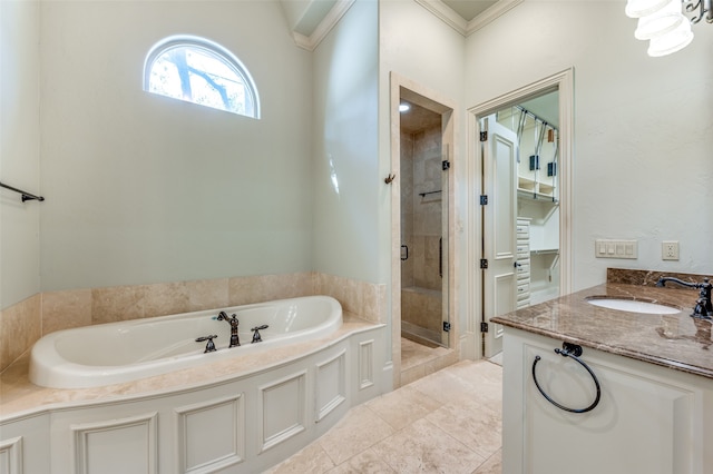 bathroom with vanity, tile patterned floors, ornamental molding, and shower with separate bathtub