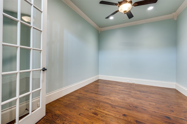 spare room with ceiling fan, dark hardwood / wood-style floors, and ornamental molding