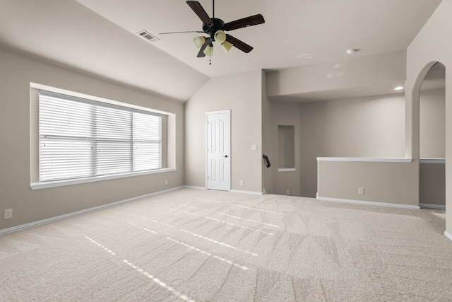 unfurnished room featuring ceiling fan, light carpet, and vaulted ceiling