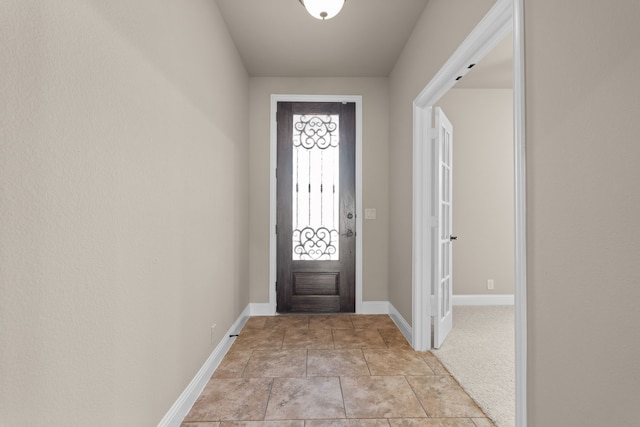 view of carpeted foyer