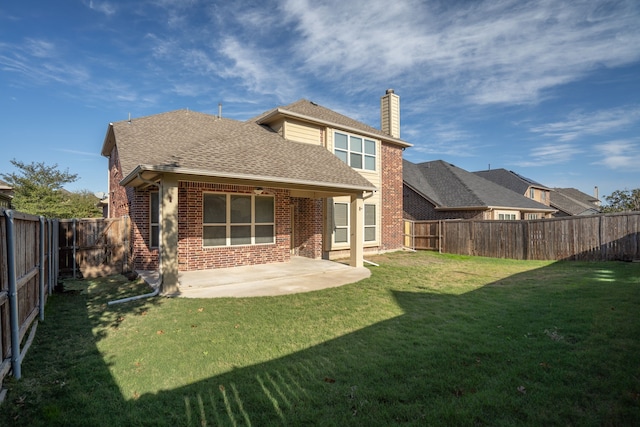 back of property featuring a lawn and a patio area