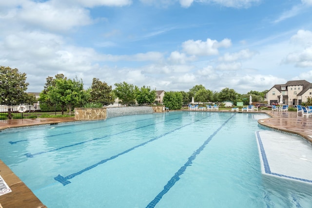 view of swimming pool featuring a patio area