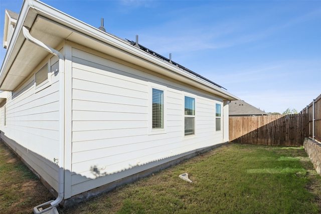 view of home's exterior featuring a yard