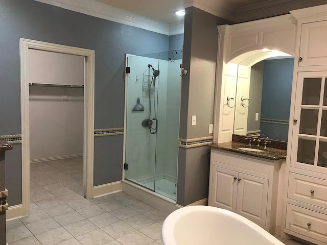 bathroom featuring ornamental molding, vanity, tile patterned floors, and independent shower and bath