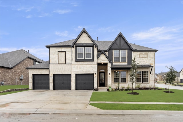 view of front facade with a garage and a front yard