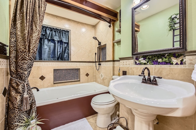 bathroom with a bathtub, tile walls, and toilet