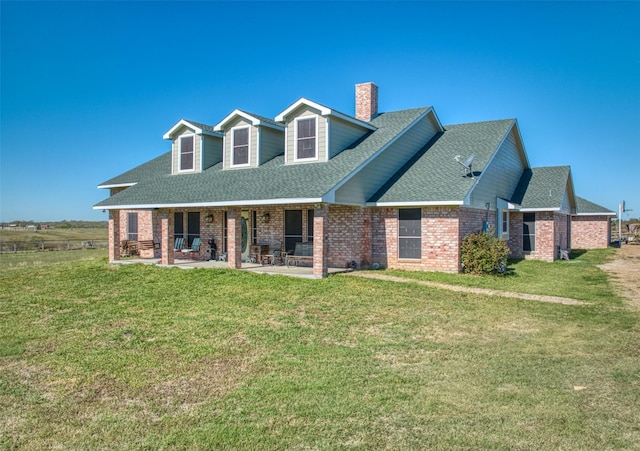 new england style home with a front lawn and a patio area