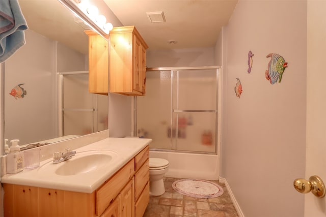 full bathroom featuring vanity, toilet, and enclosed tub / shower combo