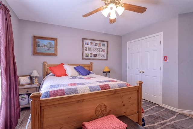 bedroom featuring ceiling fan and a closet