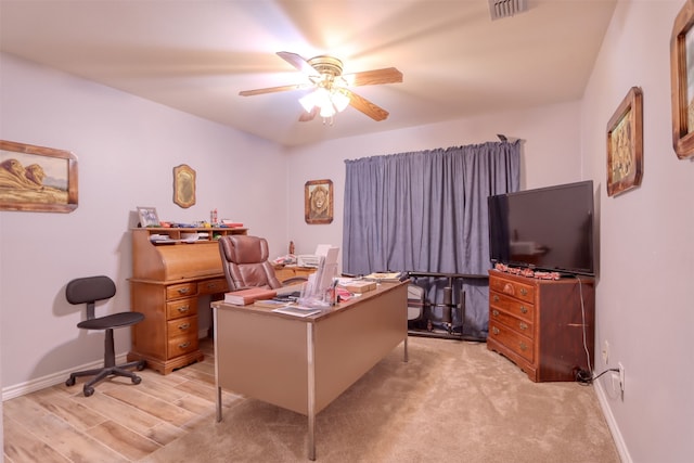 home office with ceiling fan and light wood-type flooring