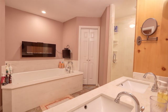 bathroom with a bathtub and vanity