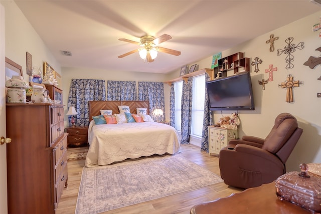 bedroom featuring light hardwood / wood-style flooring and ceiling fan