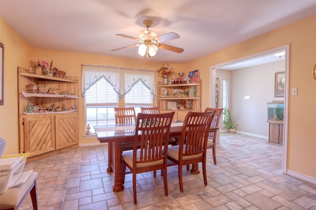 dining space featuring ceiling fan