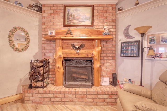 living room with a fireplace, hardwood / wood-style floors, and ornamental molding