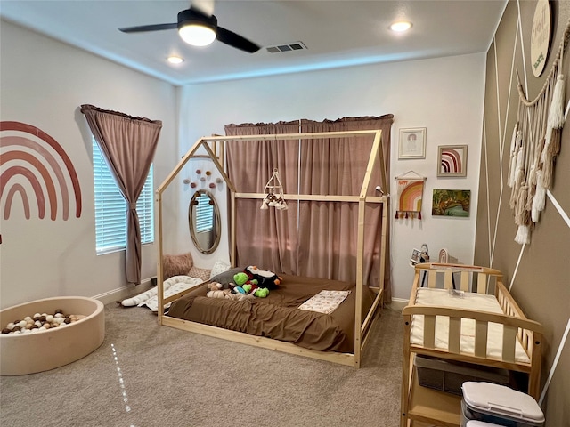 bedroom featuring ceiling fan and carpet floors