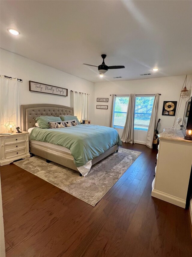 bedroom featuring ceiling fan and dark wood-type flooring