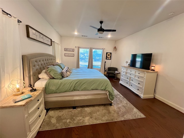 bedroom with ceiling fan and dark hardwood / wood-style flooring