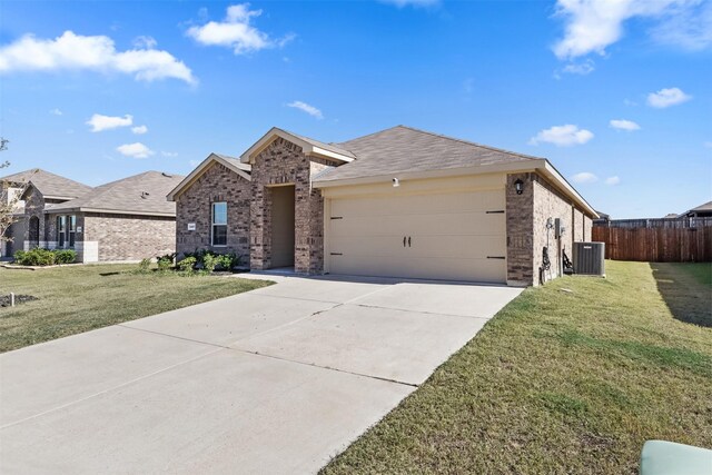 ranch-style home featuring cooling unit, a front lawn, and a garage