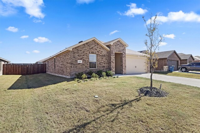 single story home featuring a front yard and a garage