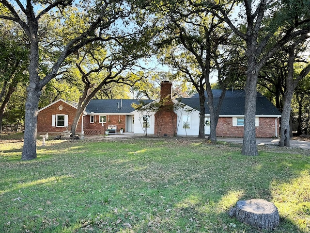 ranch-style home with a front yard