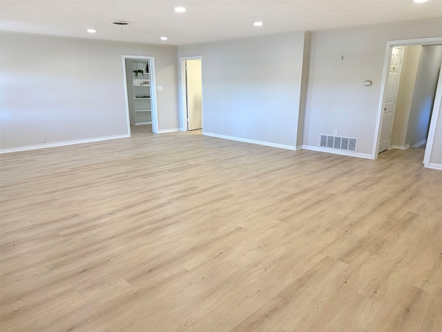 unfurnished room featuring light hardwood / wood-style floors