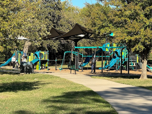 view of jungle gym with a lawn