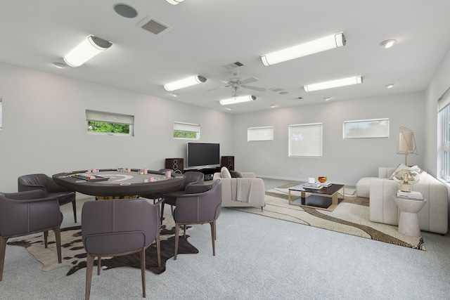 carpeted office featuring ceiling fan