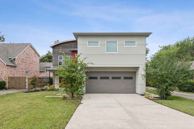 contemporary home featuring a garage and a front yard