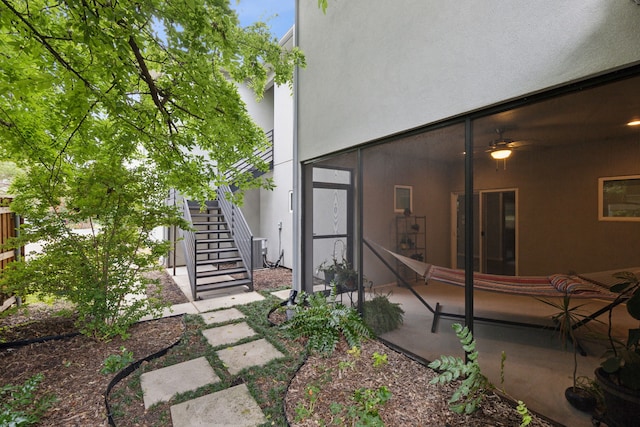 view of yard featuring central air condition unit and a patio area