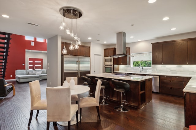 dining space featuring dark hardwood / wood-style flooring and sink