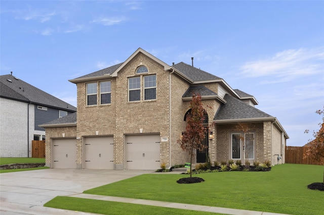 view of front of home with a garage and a front yard