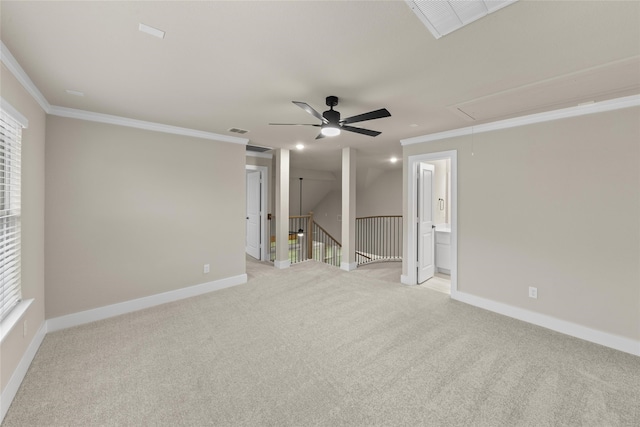 carpeted empty room featuring ceiling fan and ornamental molding