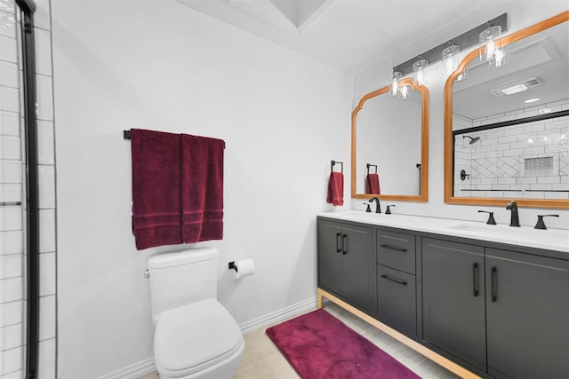 4536 Hodgkins Rd, Lake Worth, TX 76135 - bathroom with baseboards, double vanity, toilet, and tiled shower