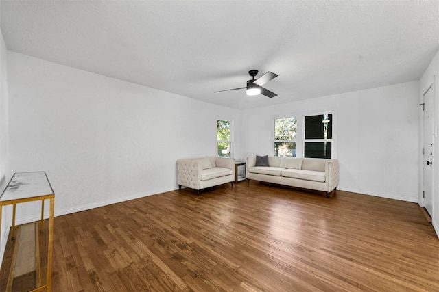 4536 Hodgkins Rd, Lake Worth, TX 76135 - unfurnished living room featuring wood finished floors, a ceiling fan, and baseboards