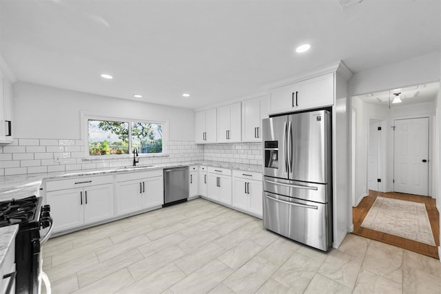 4536 Hodgkins Rd, Lake Worth, TX 76135 - kitchen with stainless steel appliances, a sink, light stone counters, tasteful backsplash, and recessed lighting