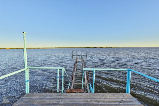 dock area featuring a water view