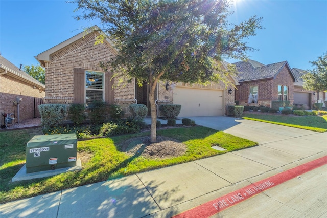 view of front of house with a front yard and a garage