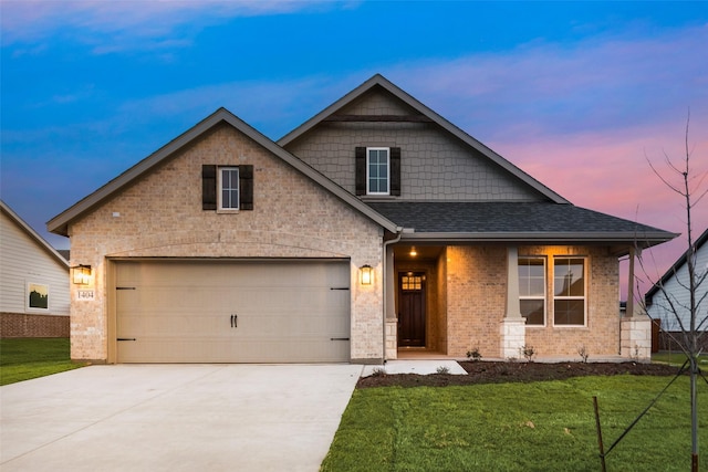 view of front of house featuring concrete driveway, roof with shingles, an attached garage, a front yard, and brick siding