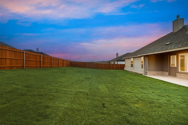 view of yard featuring a patio area and a fenced backyard