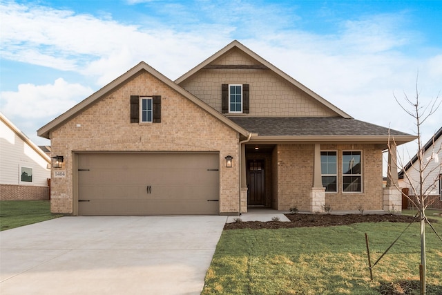 view of front facade with a shingled roof, concrete driveway, brick siding, and a front lawn