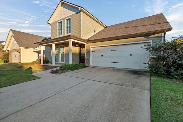 view of front facade with a garage and a front yard