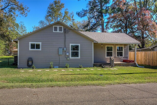 view of front of home with a front yard and a porch