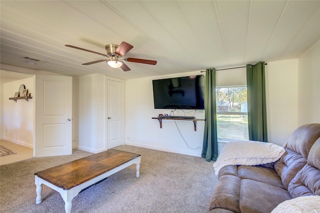 living room featuring carpet flooring and ceiling fan