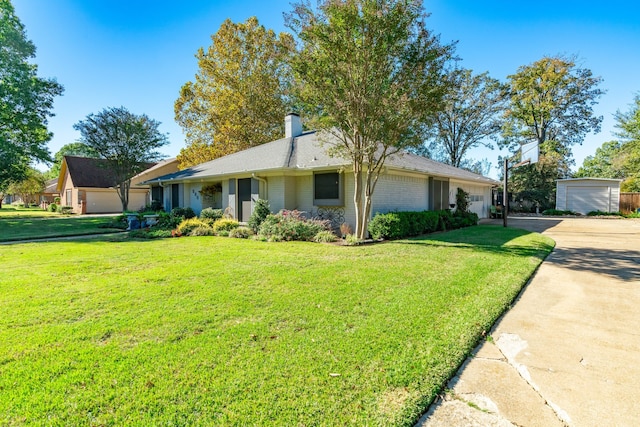 ranch-style home featuring a garage and a front lawn