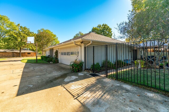 view of front facade with a front lawn and a garage