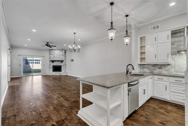 kitchen featuring dark wood-type flooring, sink, ceiling fan, light stone counters, and white cabinetry