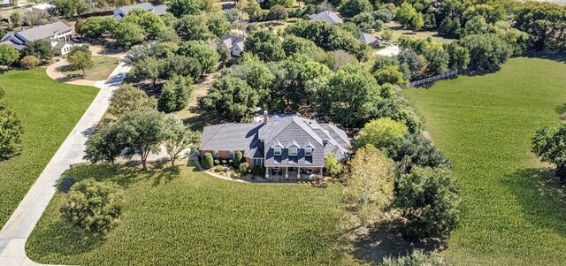 view of front of house with a porch and a front yard