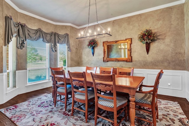 dining room featuring crown molding, a chandelier, and dark wood-type flooring