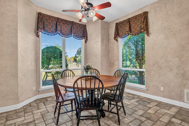 dining area with ceiling fan